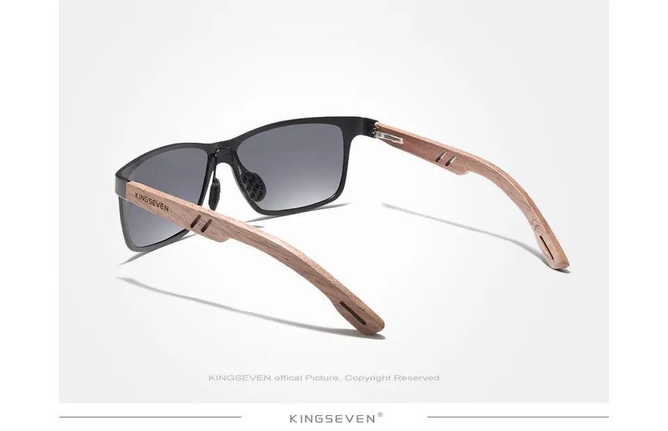 Stylish sunglasses with wooden arms and dark lenses on white background