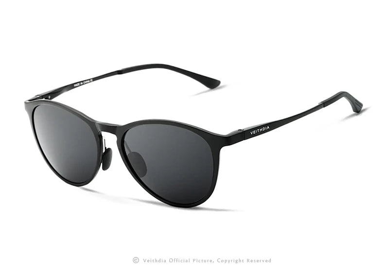 Black round-frame sunglasses with dark lenses and slim arms on a white background