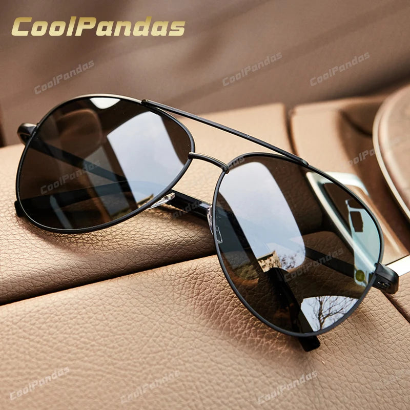 Black aviator sunglasses with dark lenses on a beige leather surface, stylish accessory