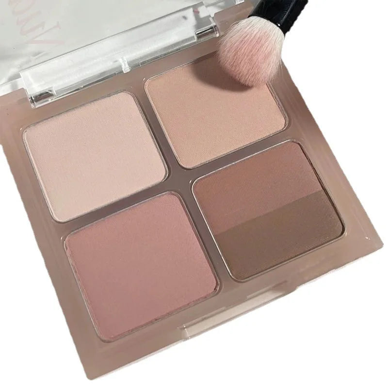 Neutral tone makeup palette with four shades and brush for contour and blush.