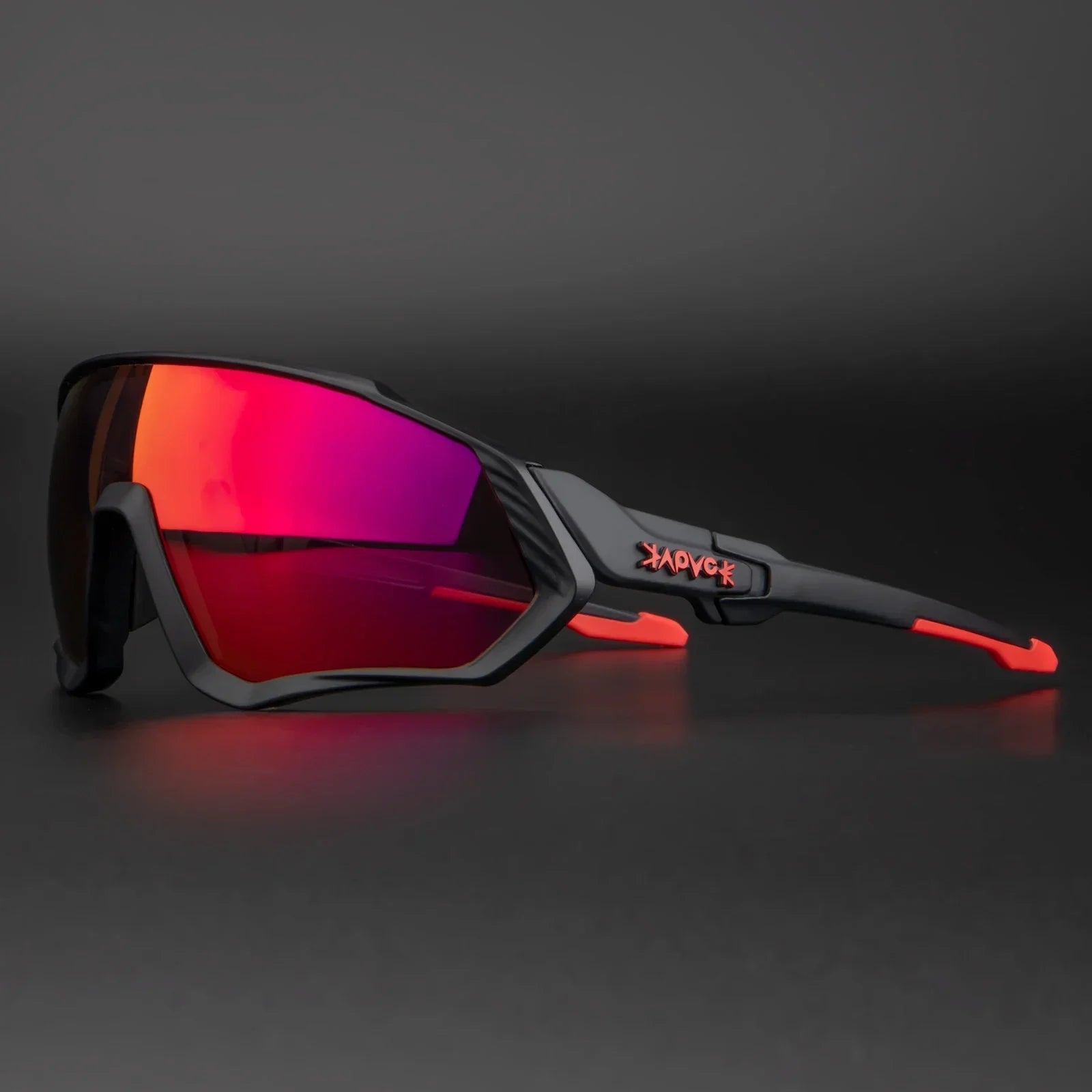 Sport sunglasses with black frame, red accents, and mirrored red lenses on dark background