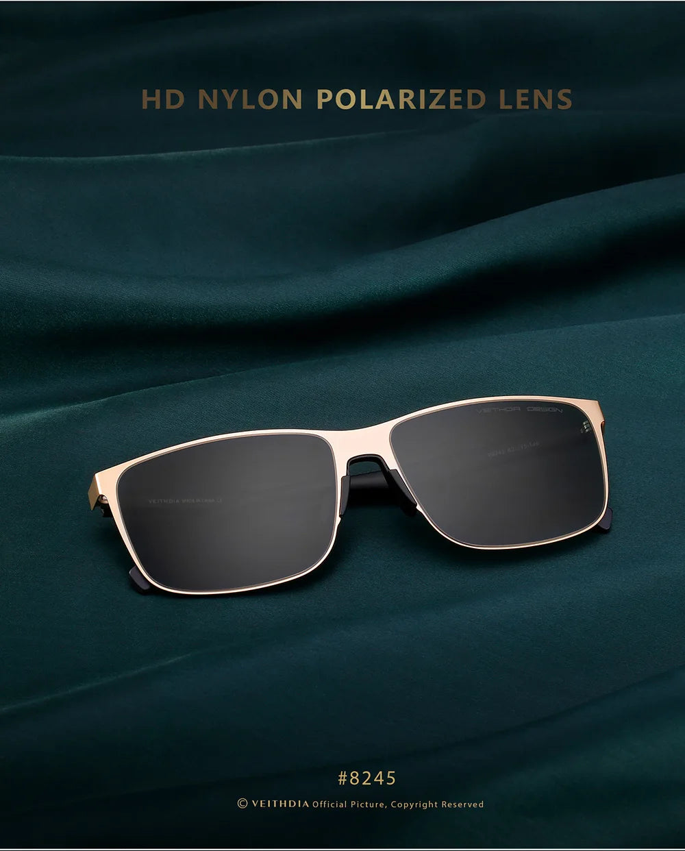 Rectangular black polarized sunglasses with gold frame displayed on dark green fabric background