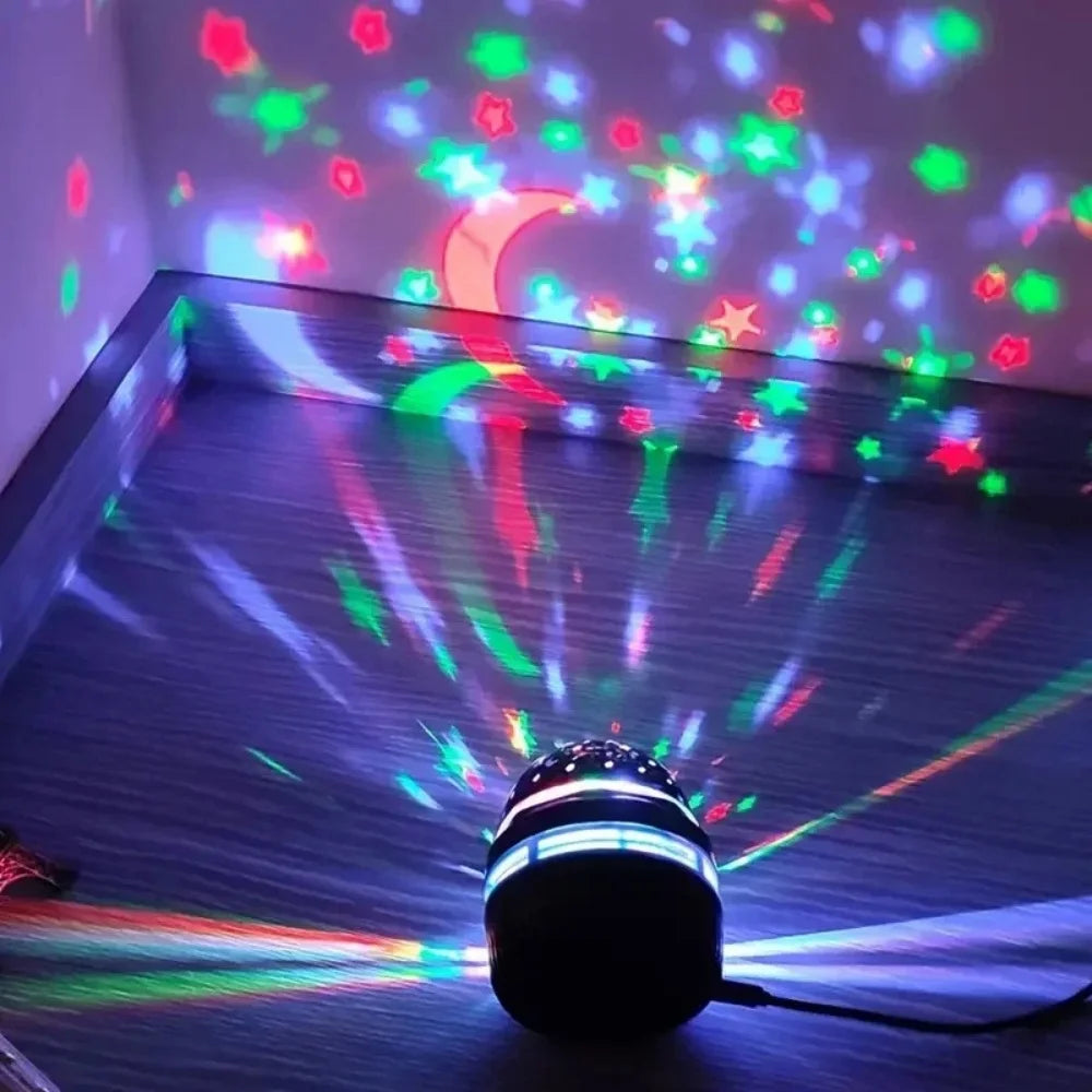 Colorful LED star and moon projector lamp casting patterns on wall and floor.