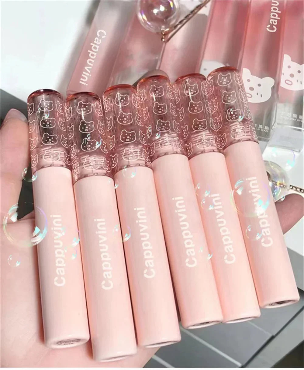 Set of Cappuvini pink lip gloss tubes with cute bear print caps, stylish cosmetic packaging