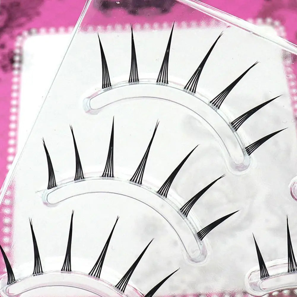 Dramatic spiky false eyelashes set on clear tray for easy application