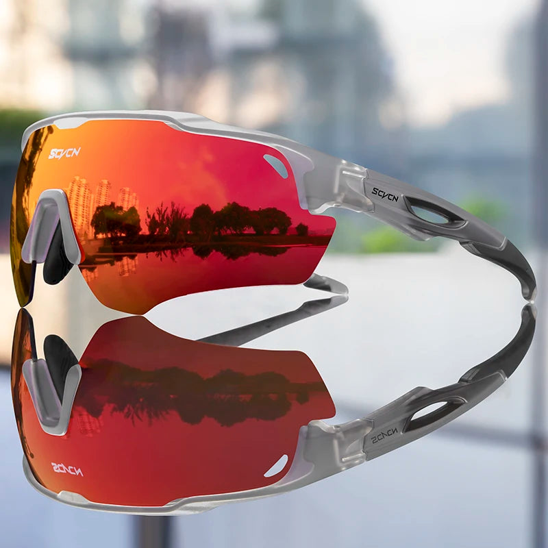 Sport sunglasses with red mirrored lenses reflecting cityscape and trees, gray frame