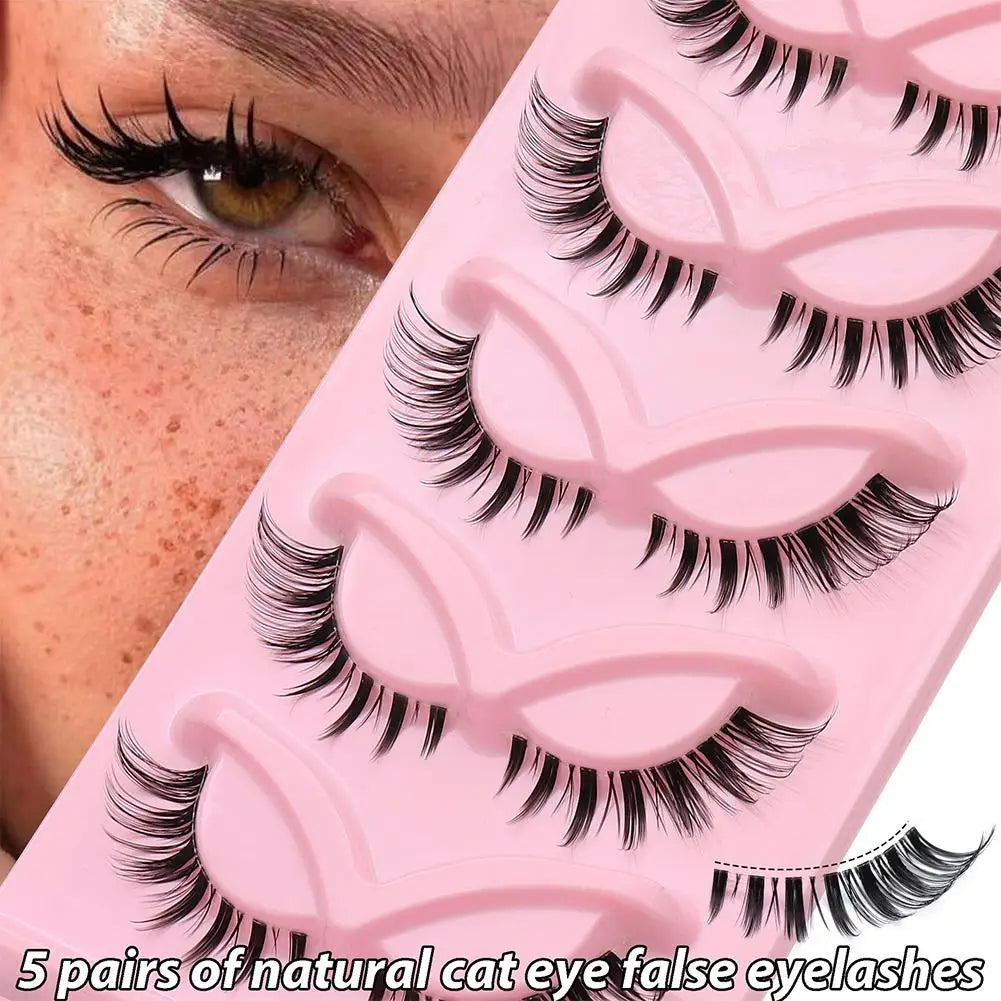 5 pairs of natural cat eye false eyelashes in a pink tray, close-up of eye wearing lashes