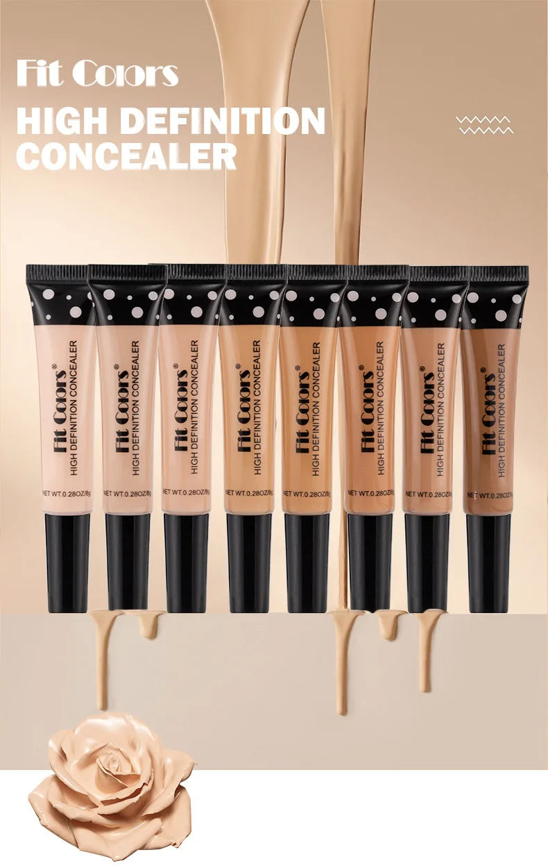 High definition concealer tubes in various shades with creamy texture and beige background.