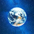 Earth from space with stars and blue nebula background