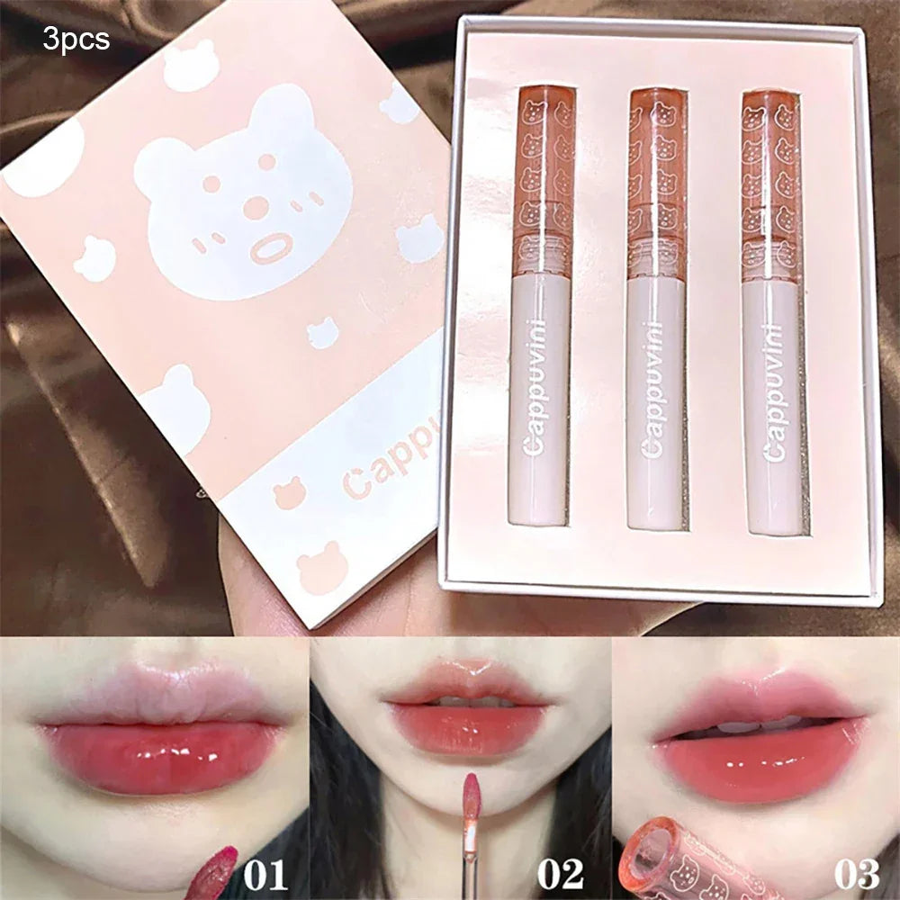 3-piece set of pink lip gloss with bear-themed packaging, glossy lip tint swatches on lips