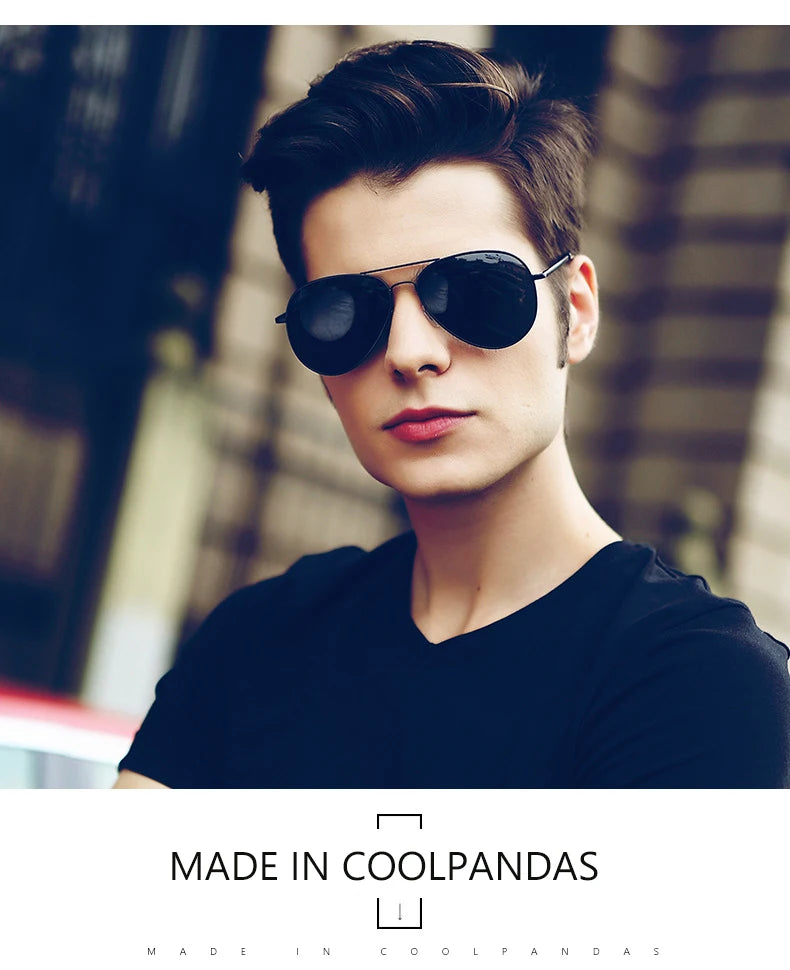 Man wearing black aviator sunglasses and black t-shirt, urban background style
