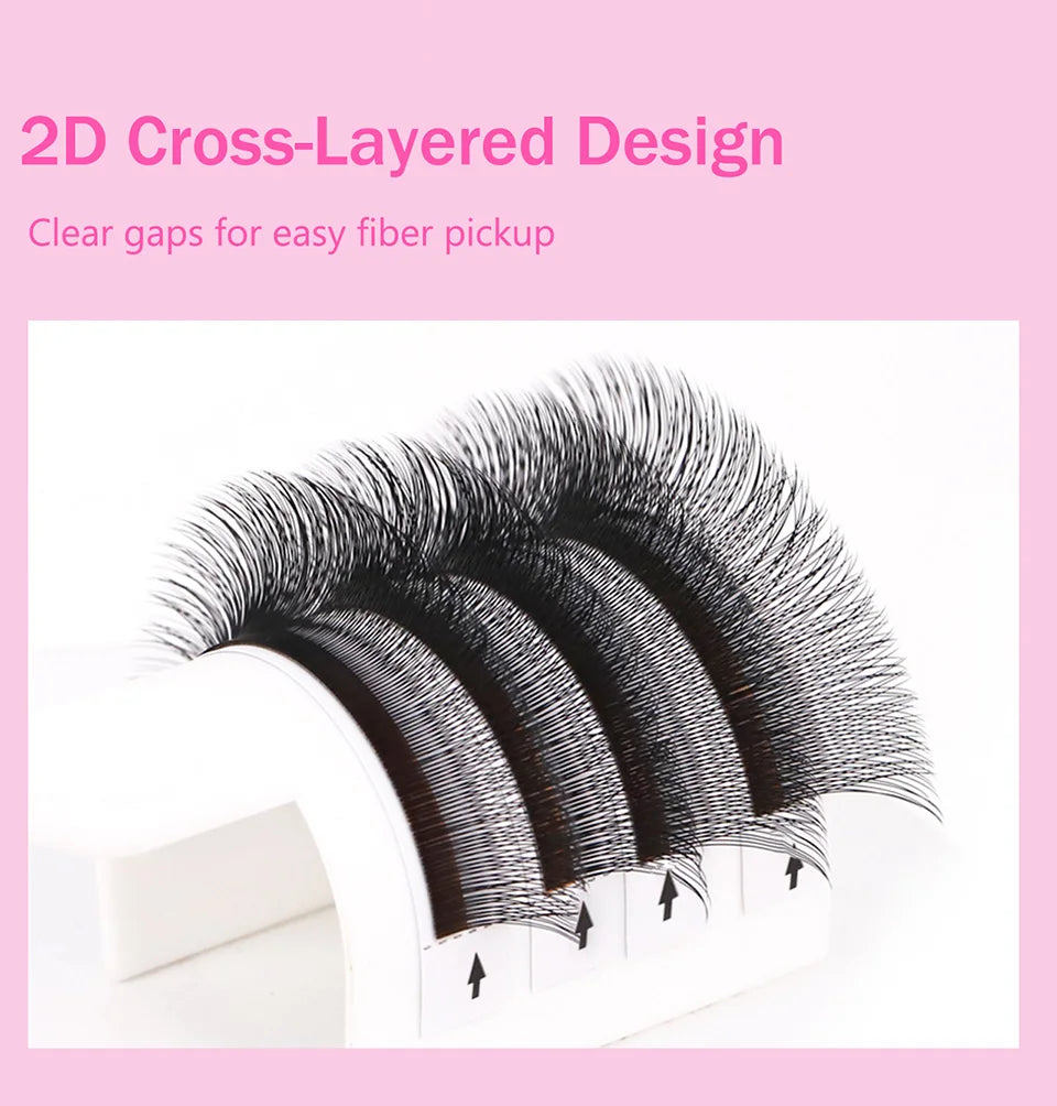 2D cross-layered eyelash extensions with clear fiber gaps on white tray, close-up view