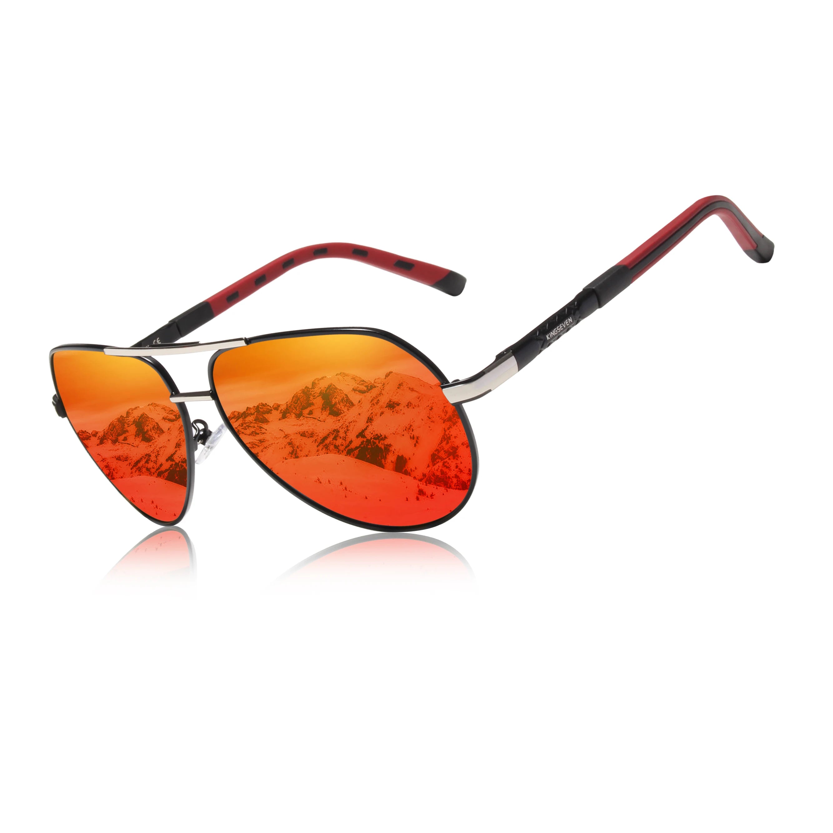 Aviator sunglasses with red-orange mirrored lenses, metal frame, and mountain reflection.