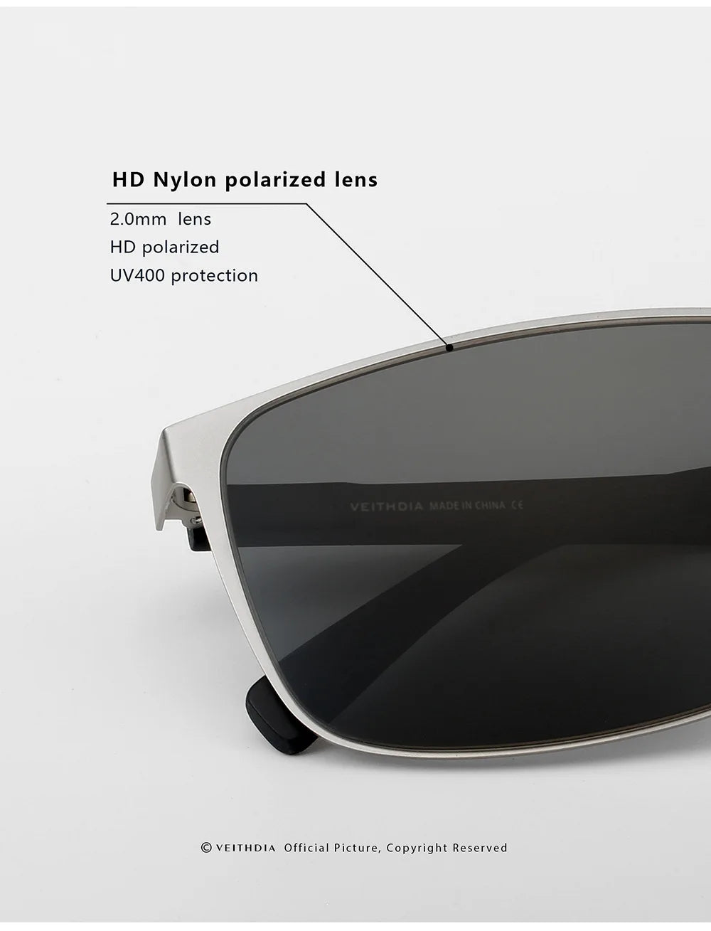 Close-up of polarized sunglasses with HD nylon lens, UV400 protection, silver frame.