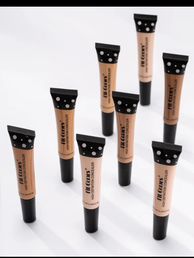 Various shades of high definition concealer tubes on a white background