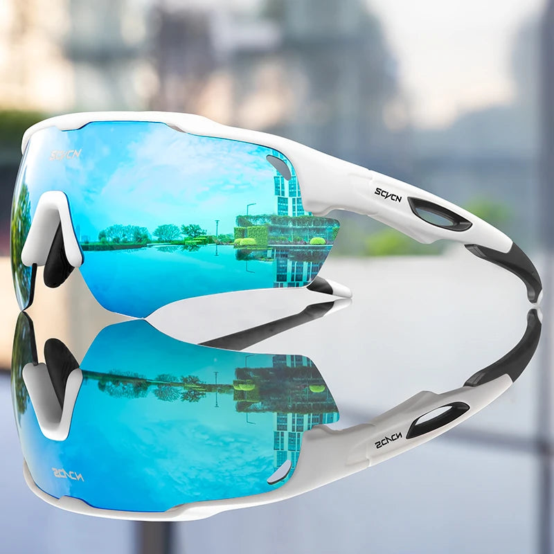 Sport sunglasses with blue reflective lenses and white frame, outdoor reflection visible