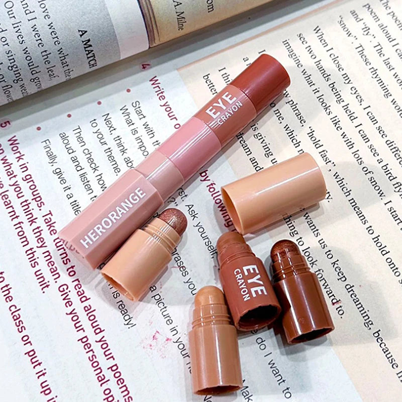 Multipurpose HERORANGE eye crayon makeup stick set with brown and nude shades on book background