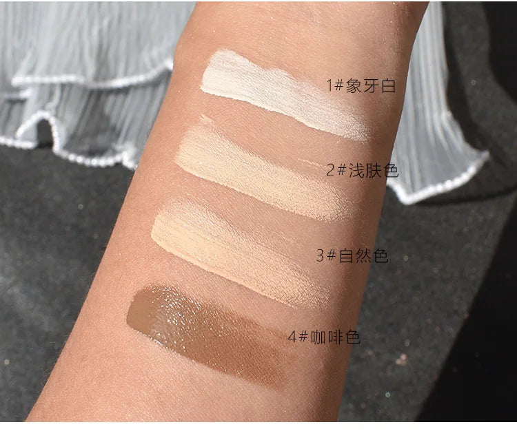 Arm with four foundation shades swatched, labeled in Chinese, showing color variety.