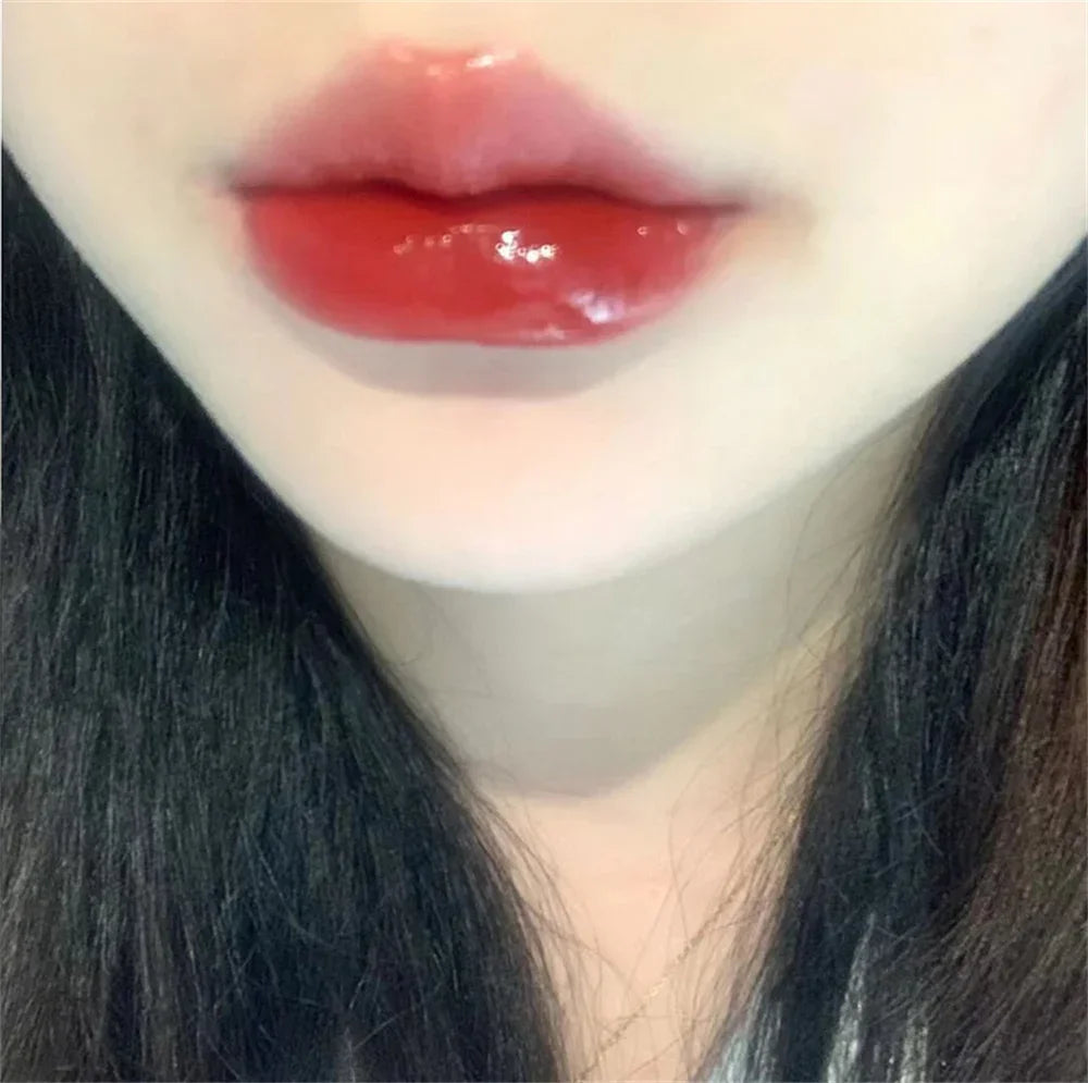 Glossy red lips with smooth makeup, close-up beauty and makeup detail