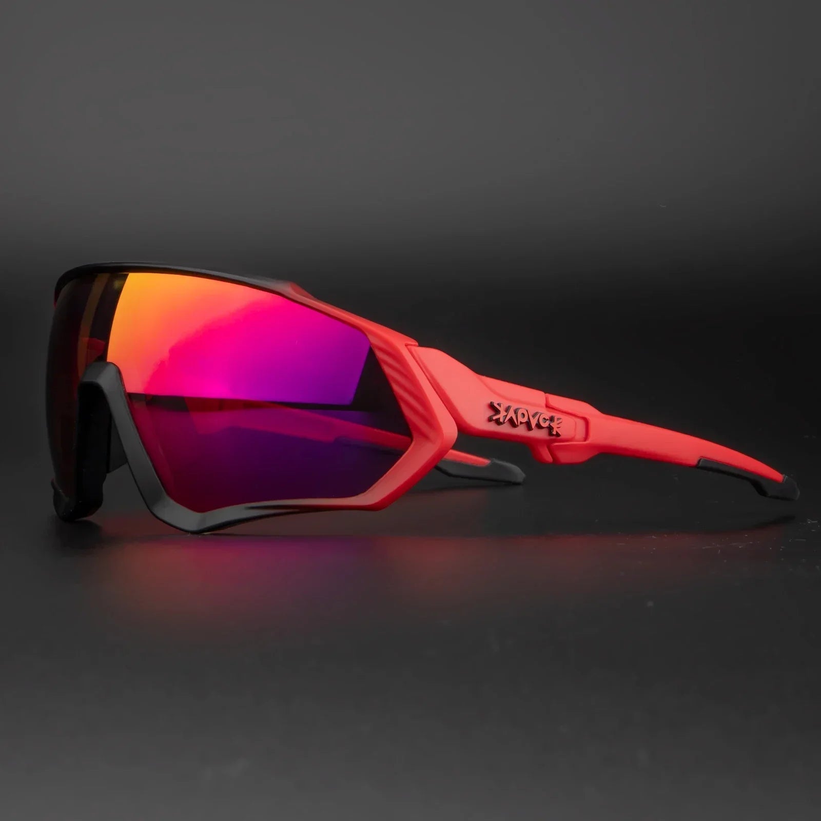 Red sports sunglasses with mirrored purple lens on black background
