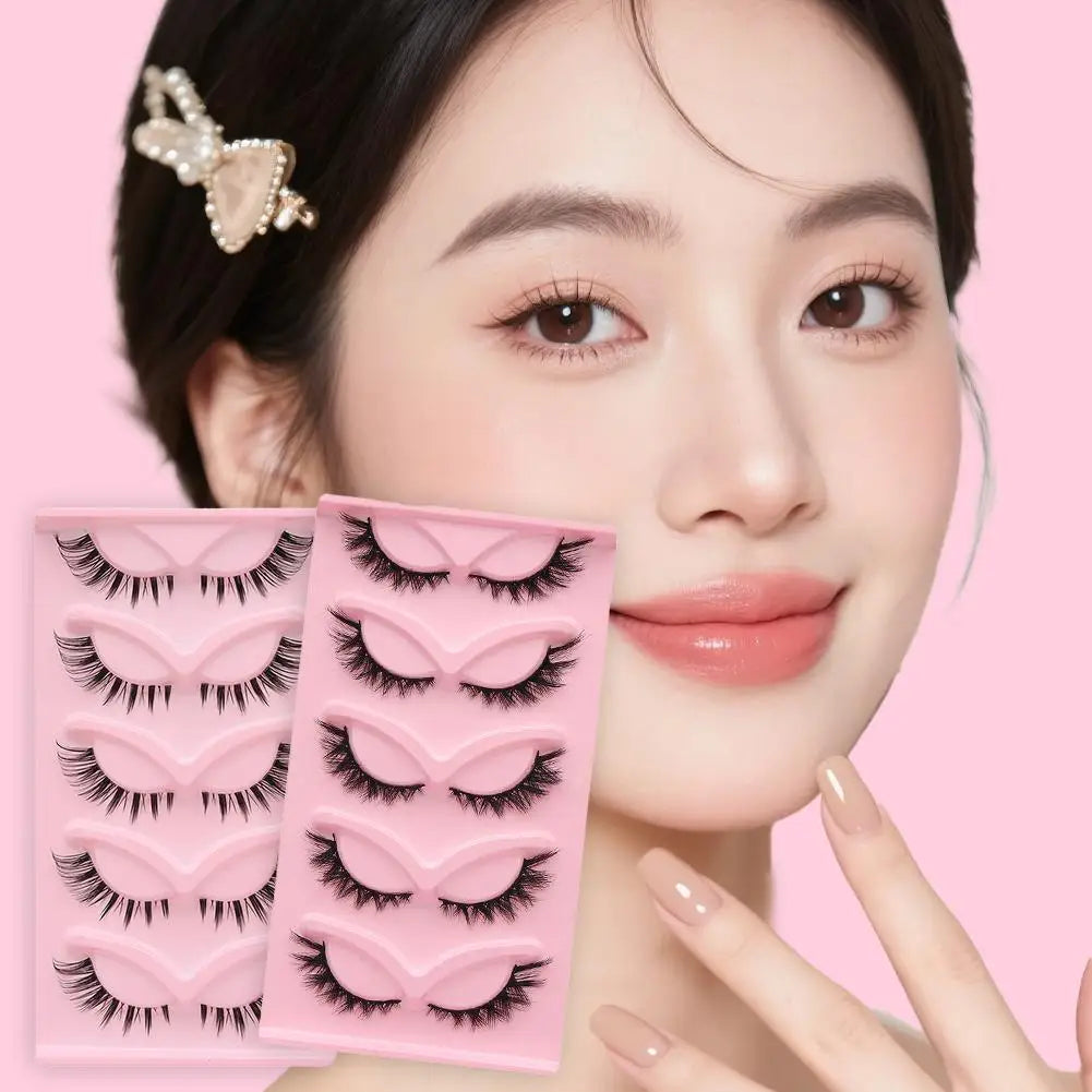 Woman with natural makeup and false eyelashes, pink background, manicure, beauty accessories