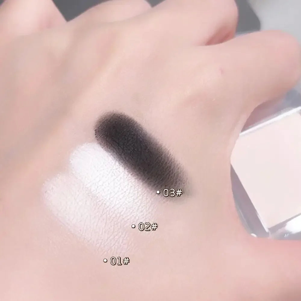 Hand showing swatches of three eyeshadow shades: two white, one black with labels 01#, 02#, 03#.