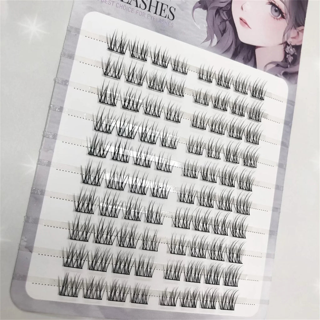 Tray of individual false eyelash clusters for eyelash extensions, close-up view