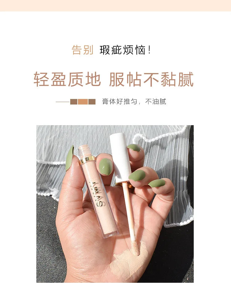 Liquid concealer with applicator held in hand, creamy texture, light beige makeup product