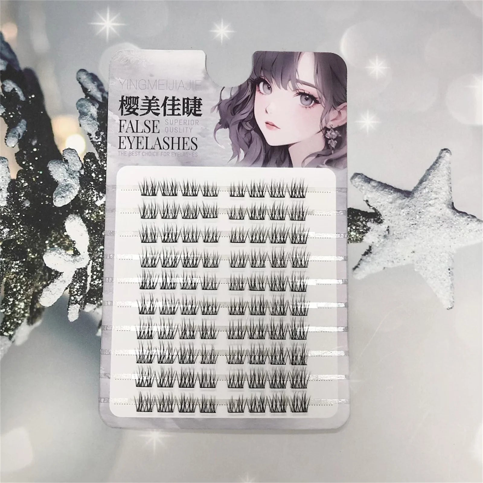 Pack of individual false eyelashes with decorative winter background and manga illustration