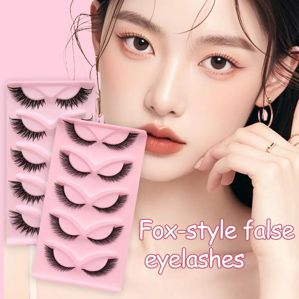 Woman wearing fox-style false eyelashes with two pink trays of dramatic lashes shown in front