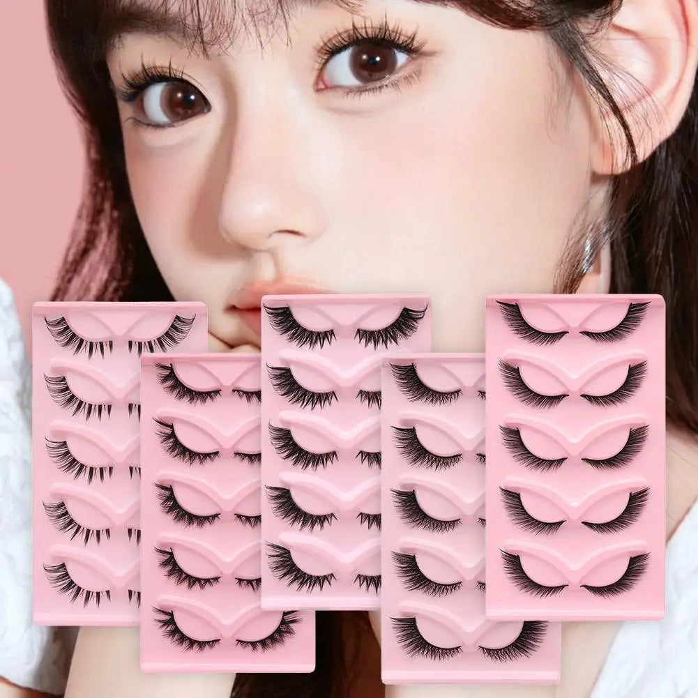 Multiple pairs of false eyelashes displayed in pink trays with a model wearing dramatic lashes.