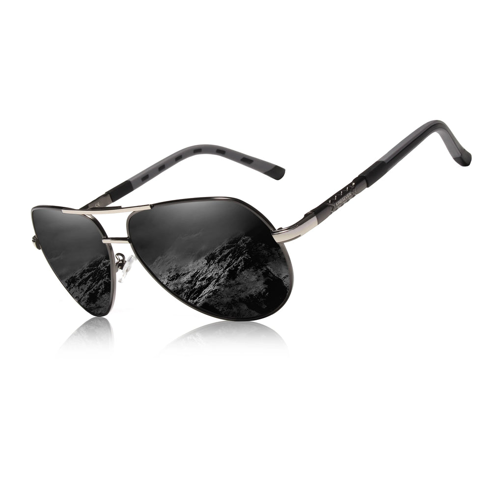 Black aviator sunglasses with reflective lenses and mountain landscape reflection