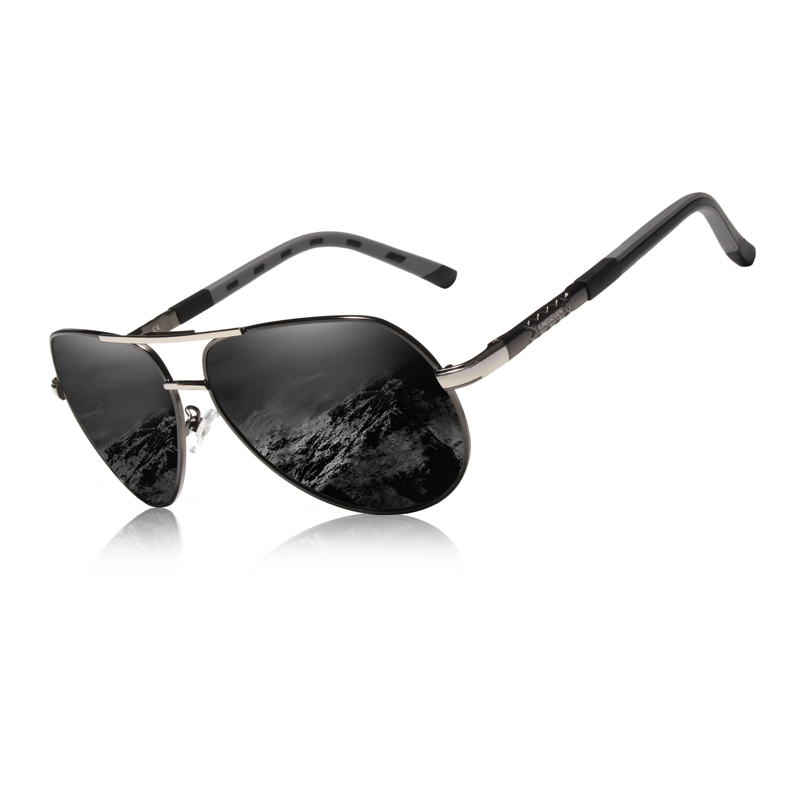 Black aviator sunglasses with reflective lenses and mountain landscape reflection