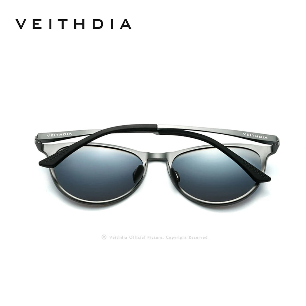 Modern round sunglasses with silver metal frame and blue gradient lenses, arms crossed
