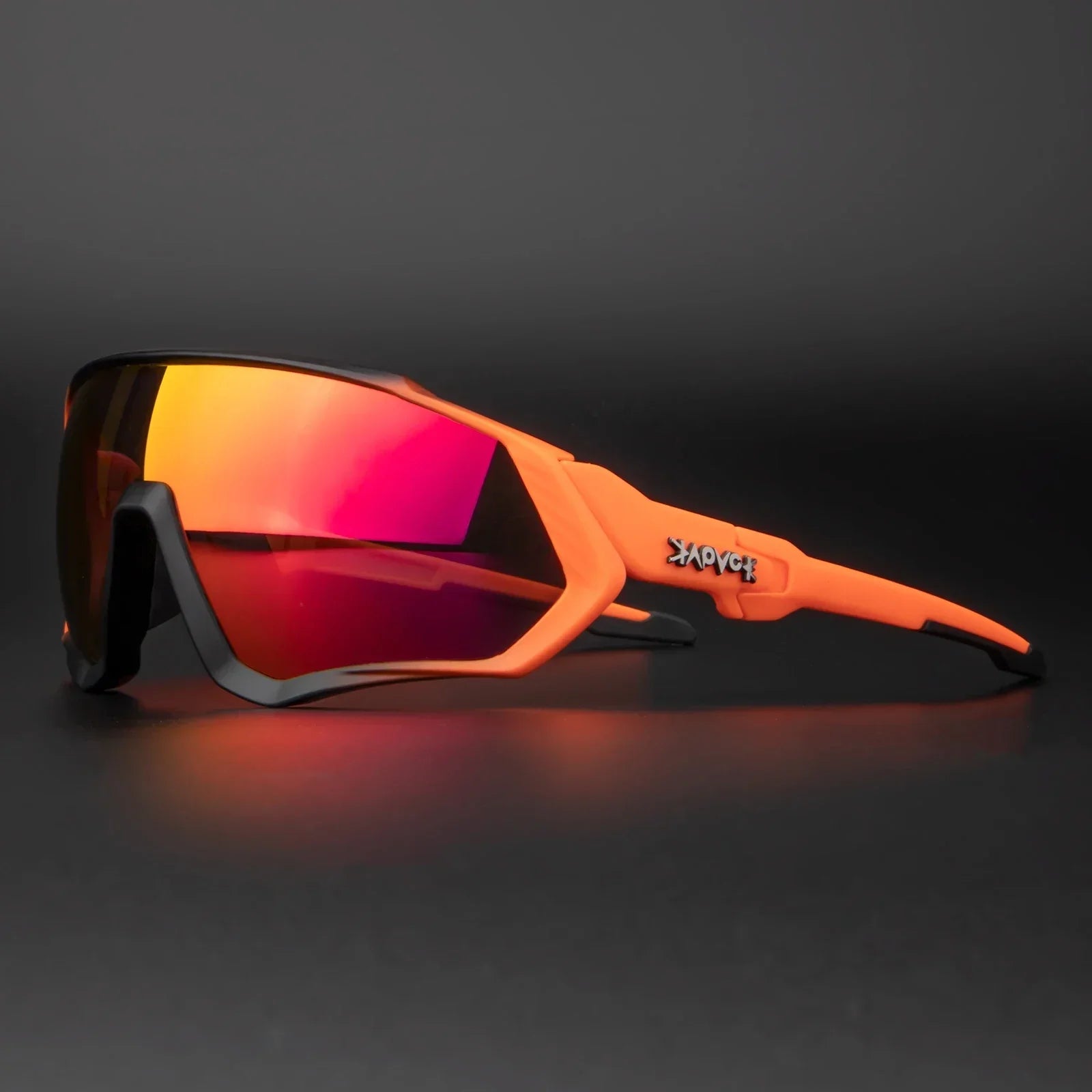 Sport sunglasses with orange frame and mirrored red lenses on dark background