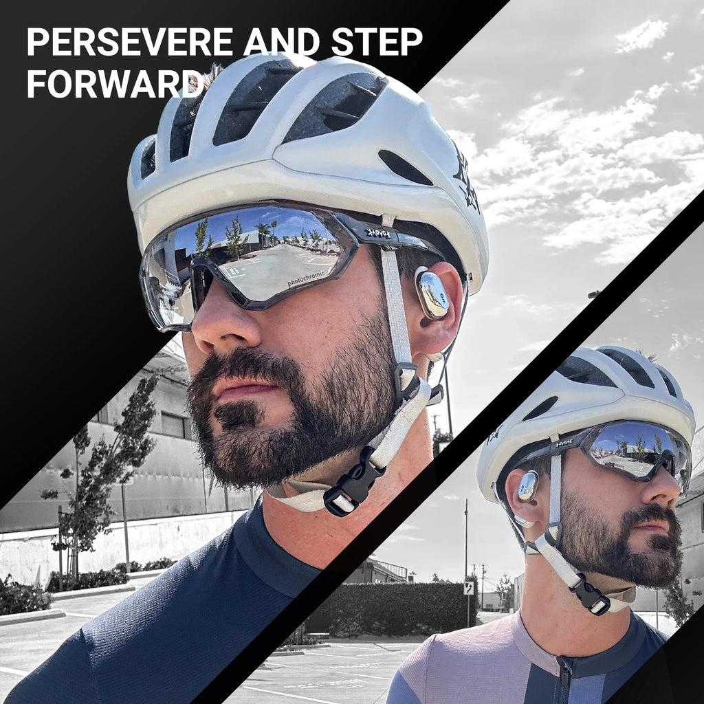 Cyclist wearing a white helmet, smart glasses, and wireless earbuds outdoors on a sunny day