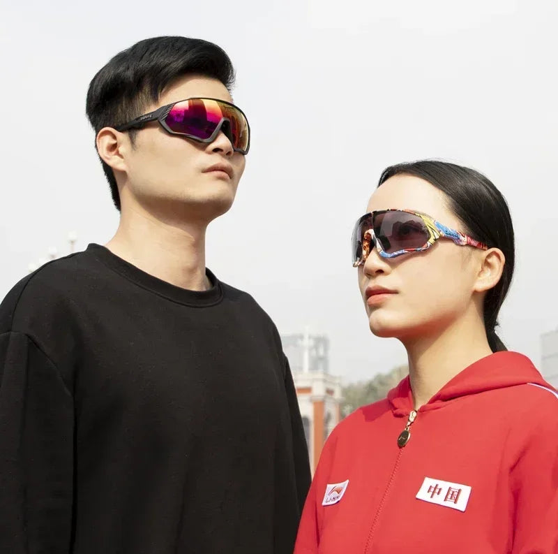 Man and woman wearing stylish mirrored sports sunglasses outdoors