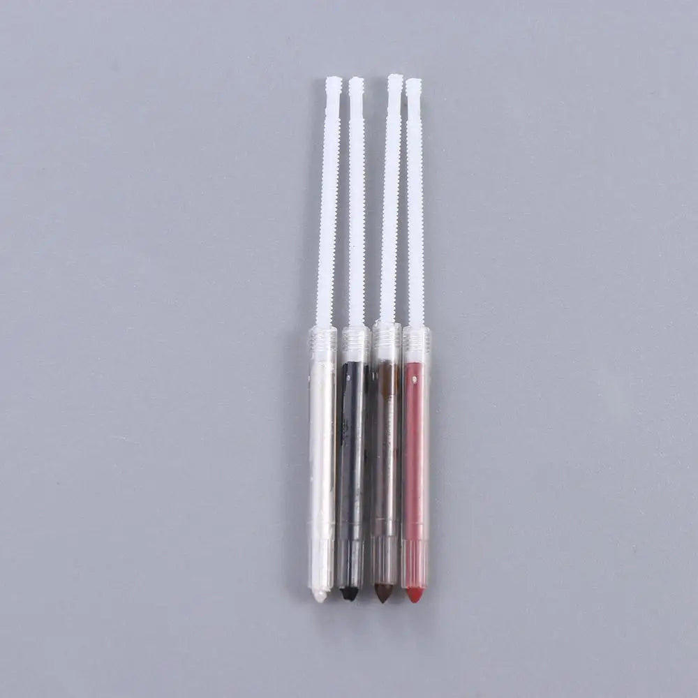 Set of four eyebrow pencils in different colors on a gray background