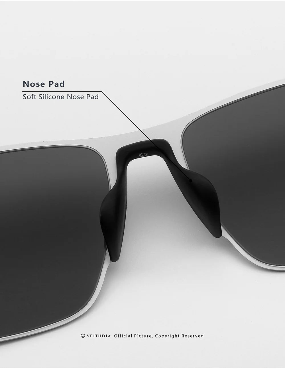 Close-up of sunglasses with soft silicone nose pads and dark lenses