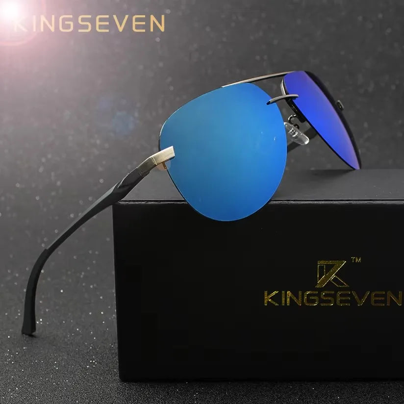 Blue mirrored aviator sunglasses with black frame displayed on a black box, luxury accessory