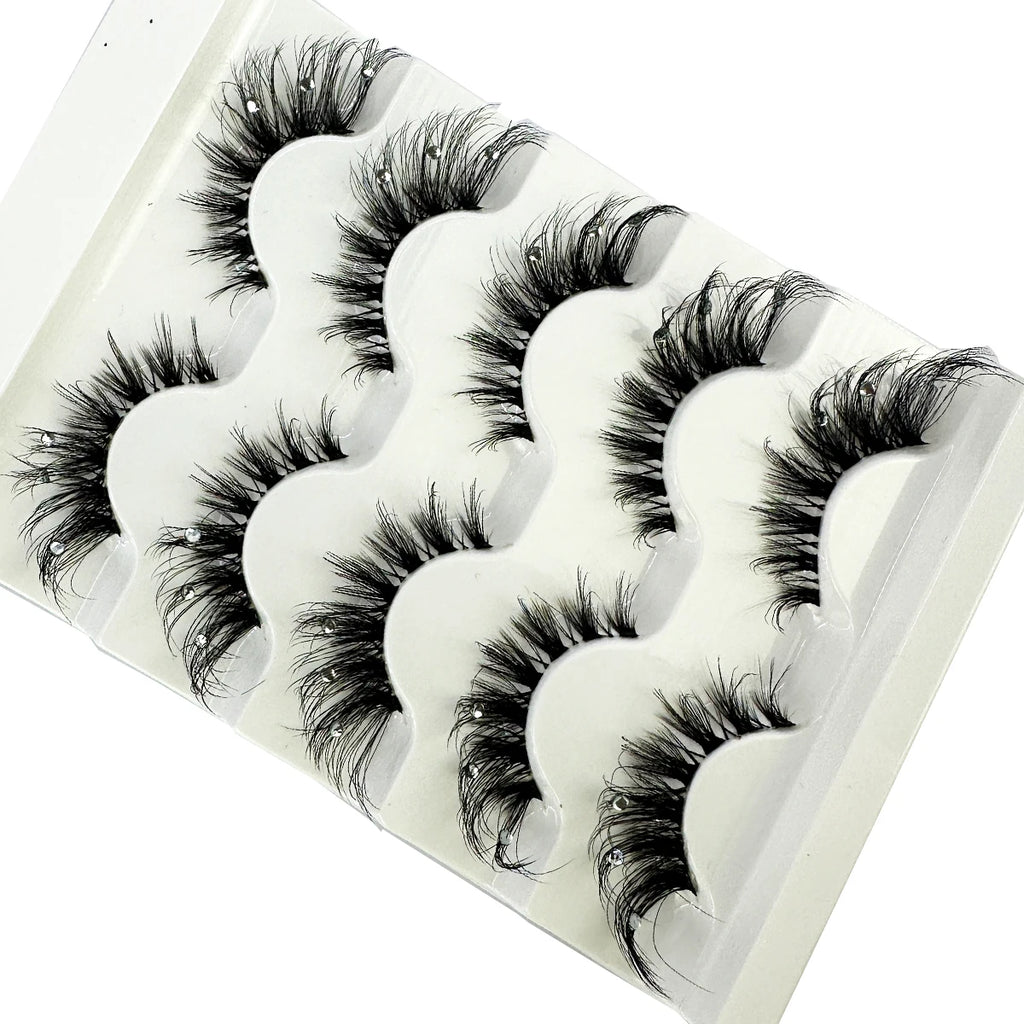 Pack of dramatic black false eyelashes with rhinestone accents in white tray