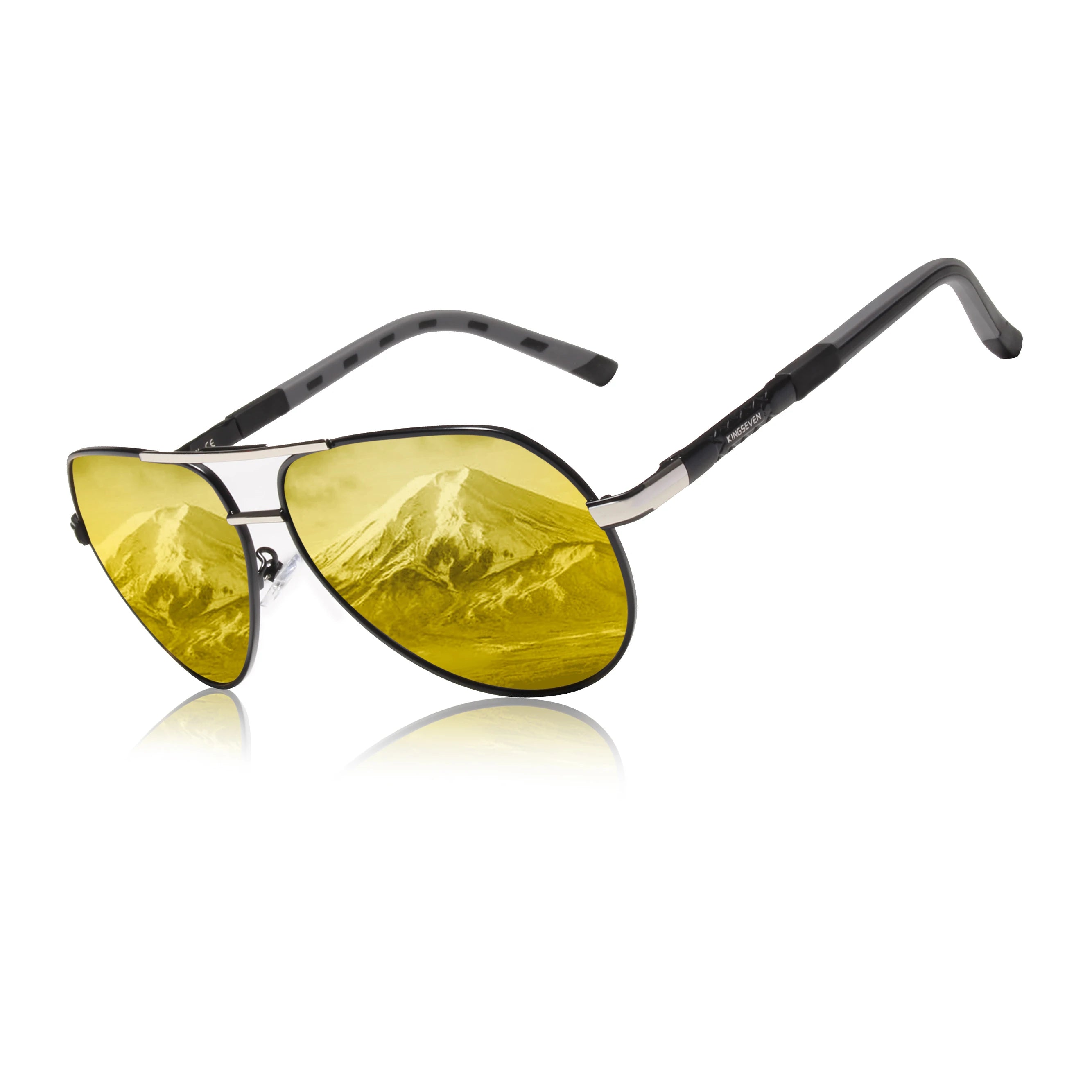 Aviator sunglasses with yellow lenses reflecting a snow-capped mountain scene.